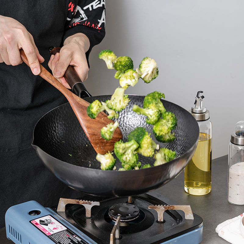 Broccoli stir-fry in a hammered wok